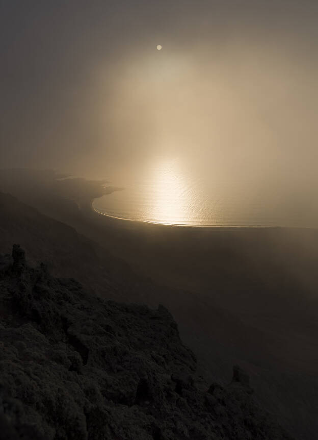 View from Mirador del Rio with clouds coming up the rock