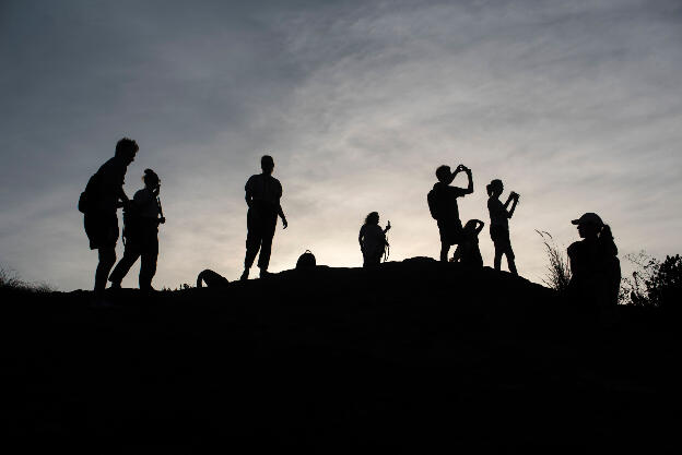Tourists on top of Pidurangala Rock at Sigiriya, Sri Lanka