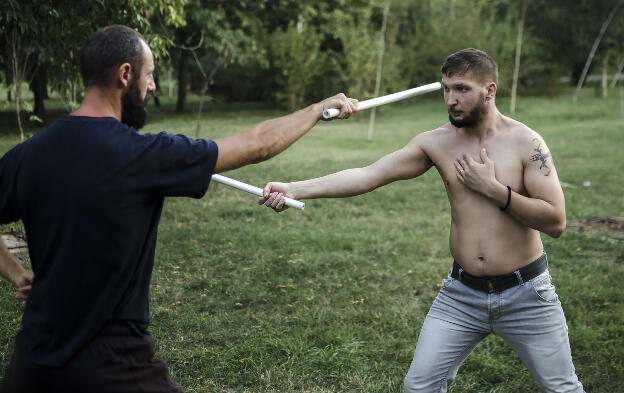 Practicing sword fighting in Bucharest park