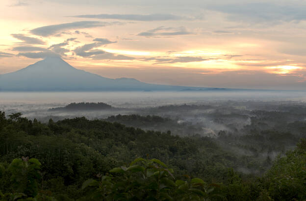 Morning mist over Borobodur temple valley
