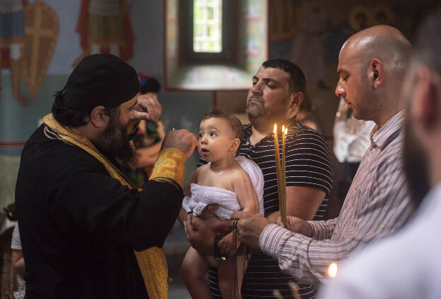 Baptising in Motsameta monastery