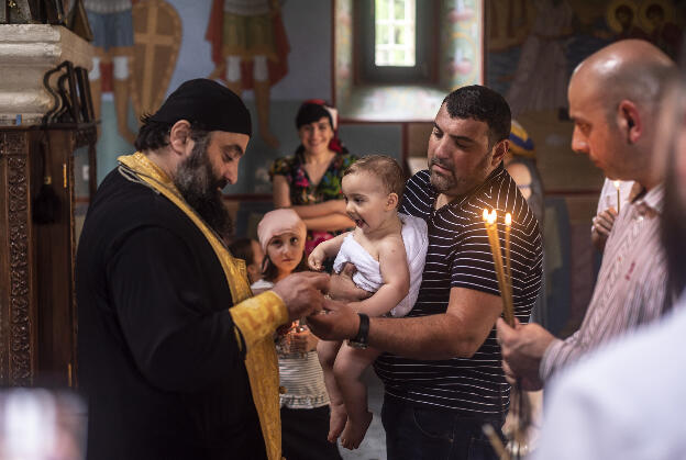 Baptising in Motsameta monastery