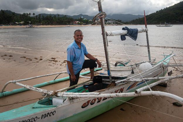 Nacpan Beach: Having caught only a couple of squid on his night cruise, he is still smiling