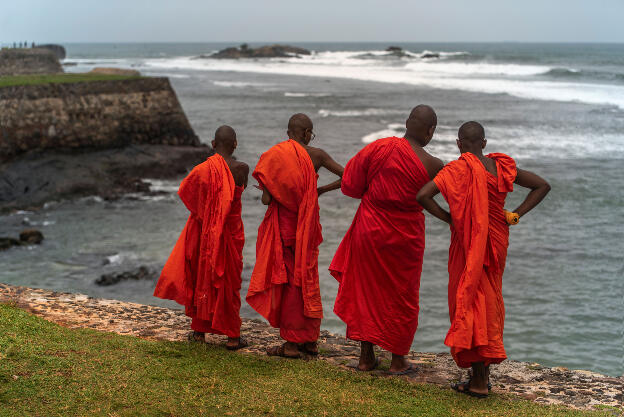 Galla, Sri Lanka: Buddhist monks enjoying the view from a Fort Bastion